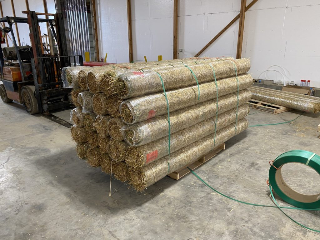 A full pallet of straw blankets ready for shipping